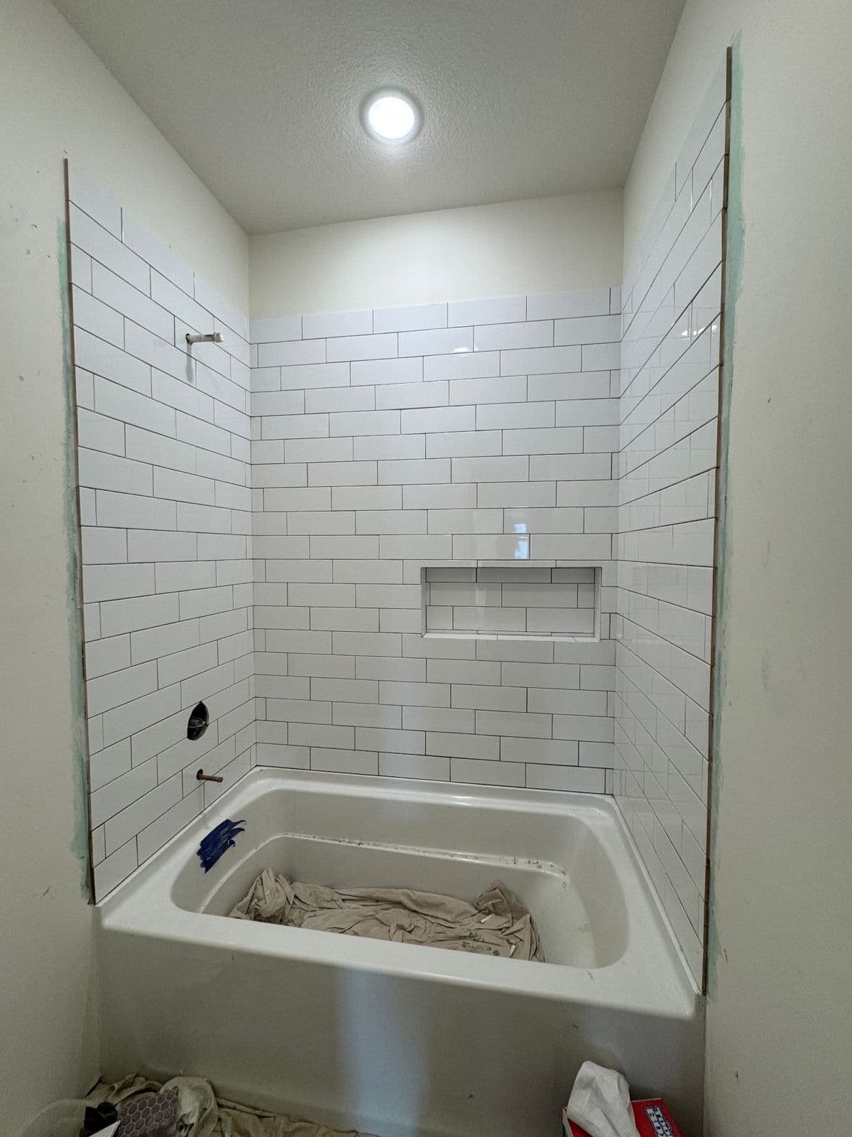Sleek Subway Tile Installation in Bathroom Remodel